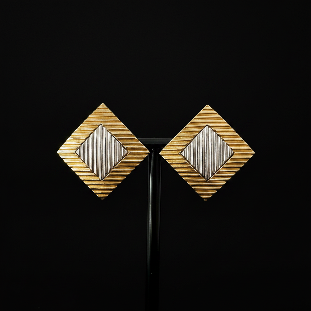 Vintage gold and silver diamond-shaped clip-on earrings, front view