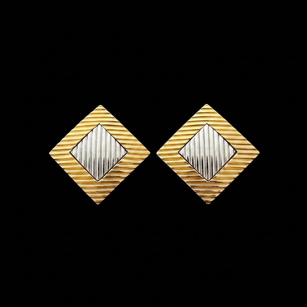 Vintage gold and silver diamond-shaped clip-on earrings, side by side