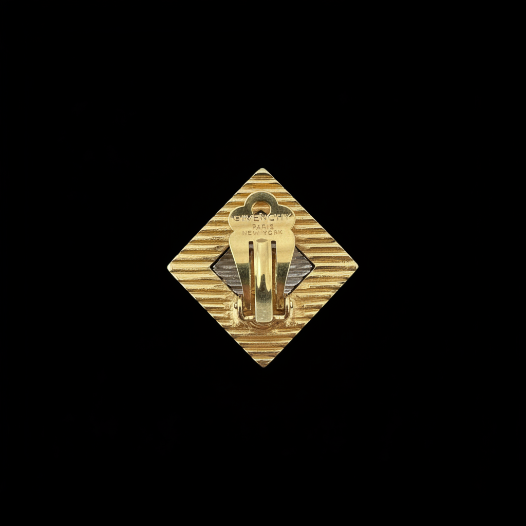 Vintage Givenchy gold clip-on earring, back close-up with stamp