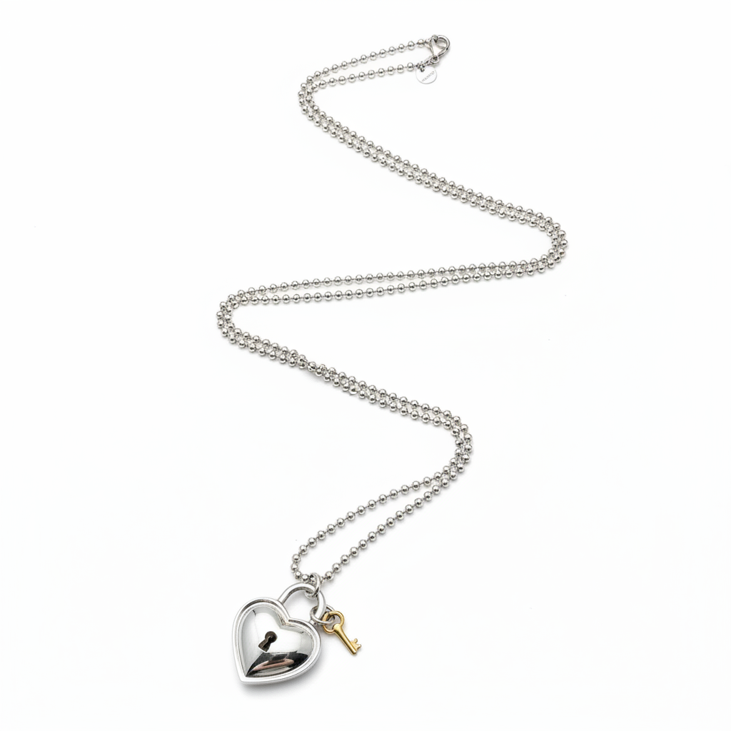 Tiffany & Co. 925 Silver & 750 Gold Heart Lock and Key Necklace 1994 - Full Chain Flat Lay
